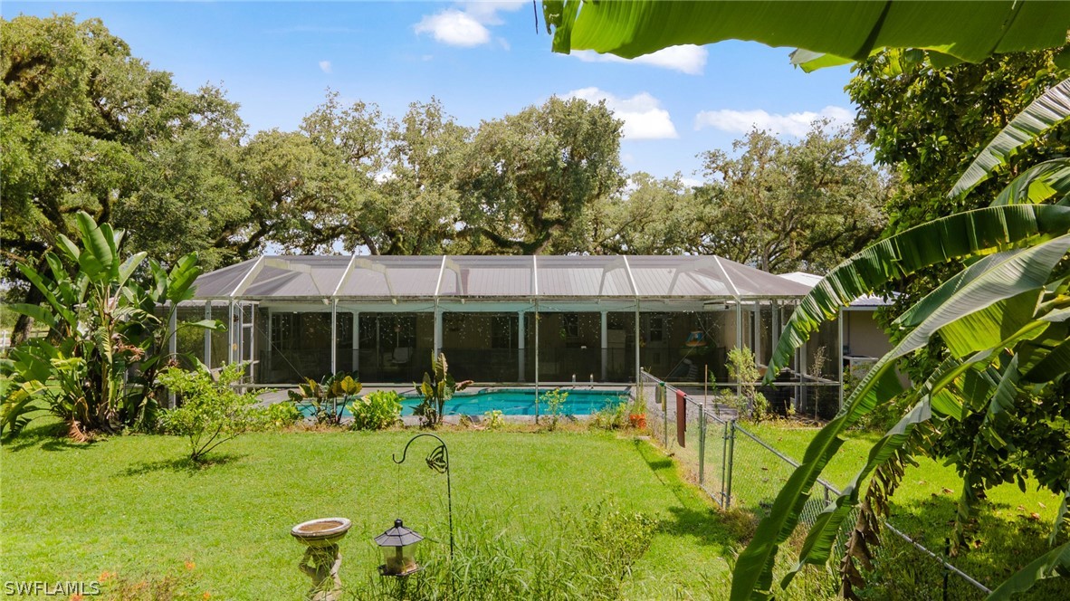 2340 Old N River Road LaBelle, FL 33935 - Photo 19 of 28 a view of a house with backyard and sitting area