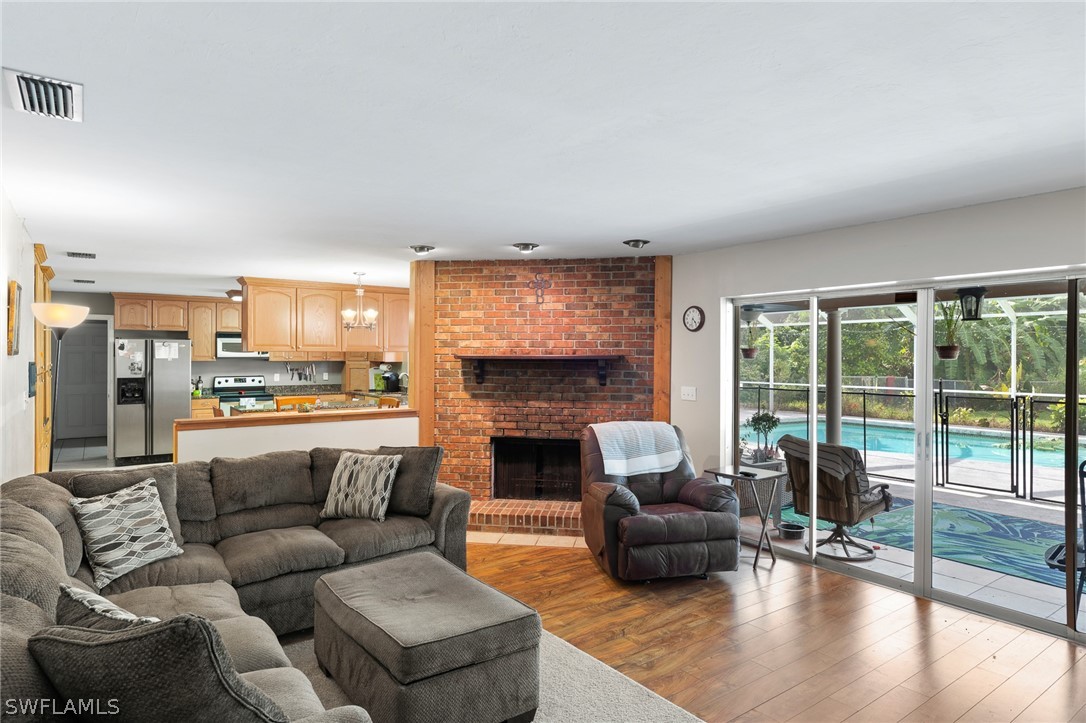 2340 Old N River Road LaBelle, FL 33935 - Photo 2 of 28 a living room with furniture and a fireplace