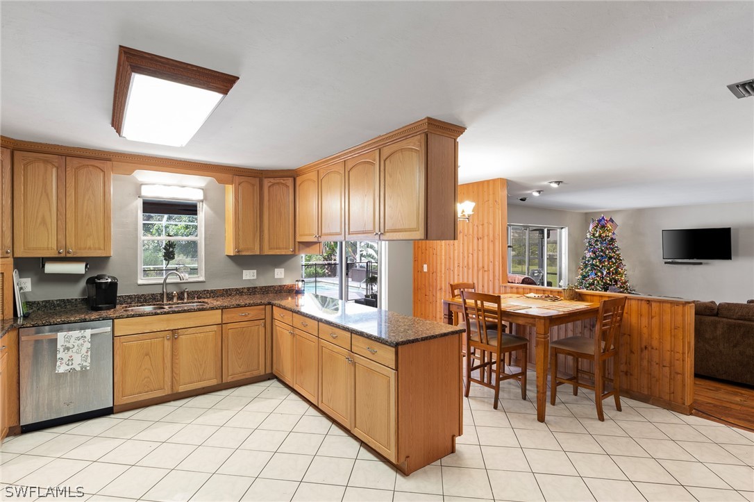 2340 Old N River Road LaBelle, FL 33935 - Photo 3 of 28 a kitchen with stainless steel appliances granite countertop a sink and a refrigerator