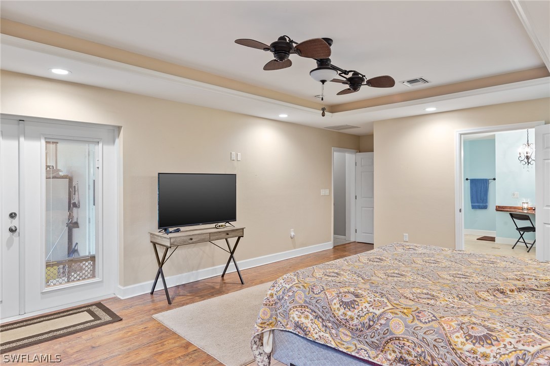 2340 Old N River Road LaBelle, FL 33935 - Photo 7 of 28 a bedroom with a bed and a flat screen tv