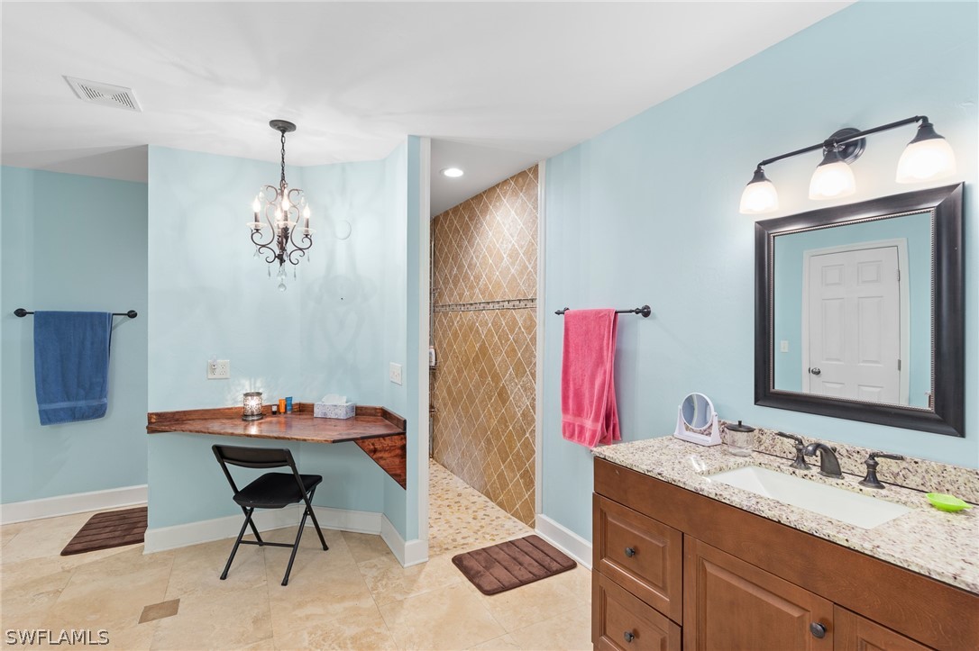 2340 Old N River Road LaBelle, FL 33935 - Photo 10 of 28 a bathroom with a sink vanity and a mirror