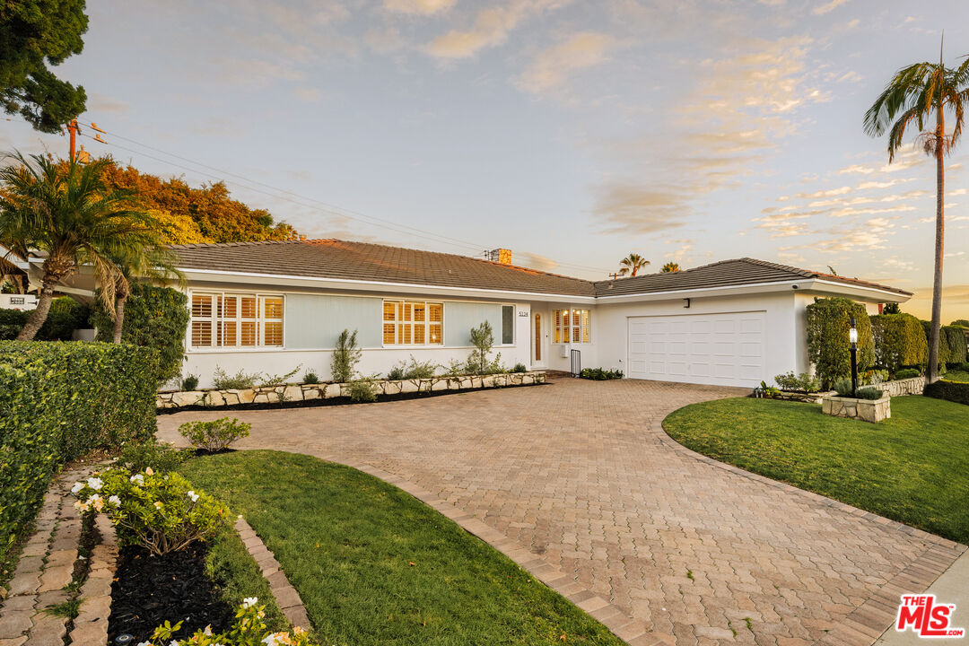 5124 South Corning Avenue Los Angeles, CA 90056 - Photo 1 of 30 a view of a house with garden and a yard