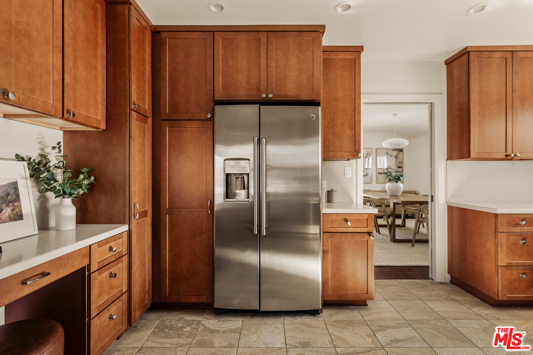 5124 South Corning Avenue Los Angeles, CA 90056 - Photo 12 of 30 a kitchen with stainless steel appliances granite countertop a refrigerator and a sink