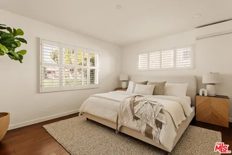 a bathroom with a sink vanity and mirror