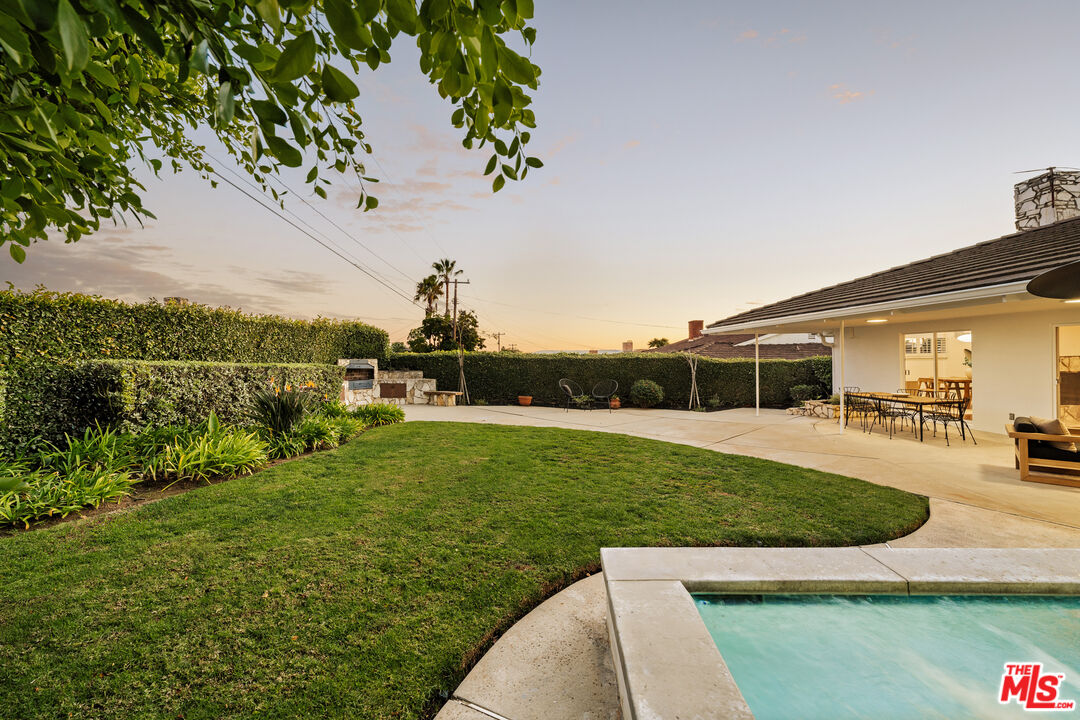 5124 South Corning Avenue Los Angeles, CA 90056 - Photo 29 of 30 a view of yard with swimming pool and green space