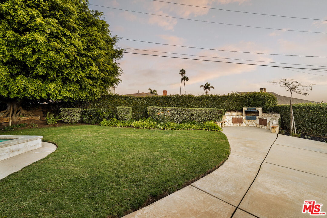 5124 South Corning Avenue Los Angeles, CA 90056 - Photo 7 of 30 a view of a swimming pool with a lawn chairs