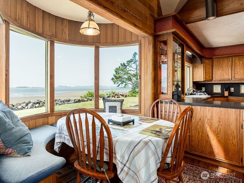 633 Highway 101 Chinook, WA 98614 - Photo 16 of 39 a view of a dining room with furniture window and outside view