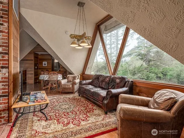 a view of a livingroom with furniture and wooden floor