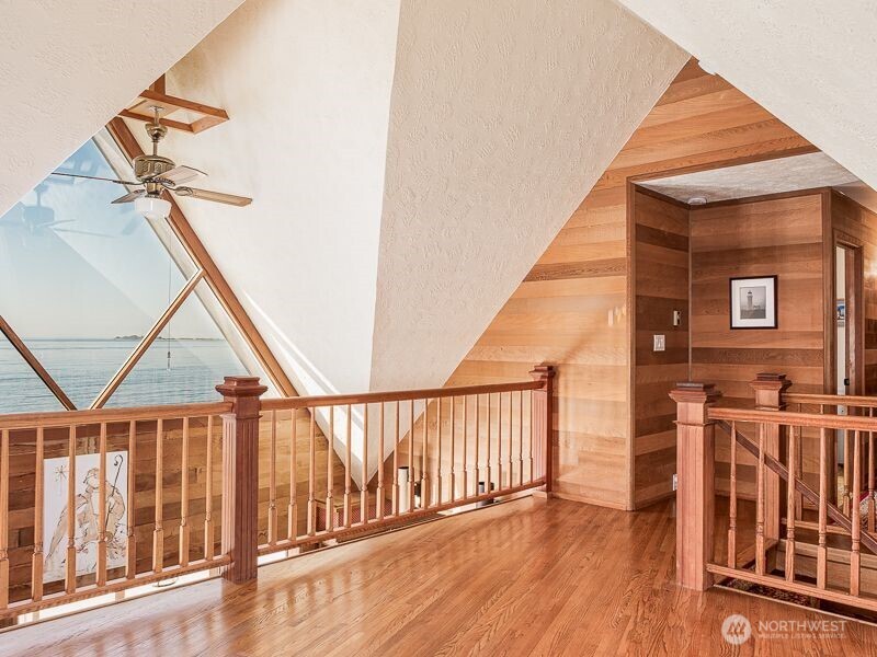 633 Highway 101 Chinook, WA 98614 - Photo 20 of 39 a view of staircase with railing and white walls