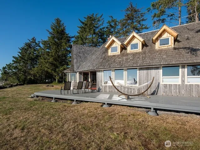 a roof deck with a table and chairs