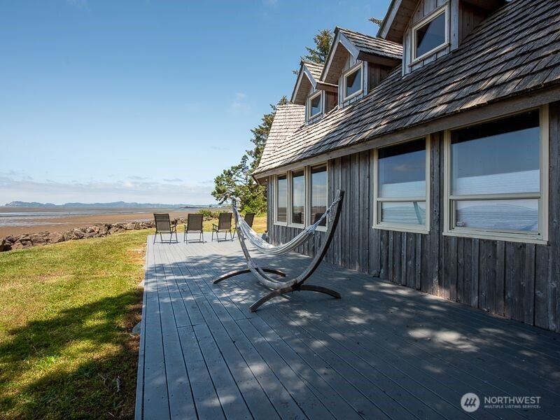 633 Highway 101 Chinook, WA 98614 - Photo 30 of 39 a view of a roof deck with chair and wooden floor