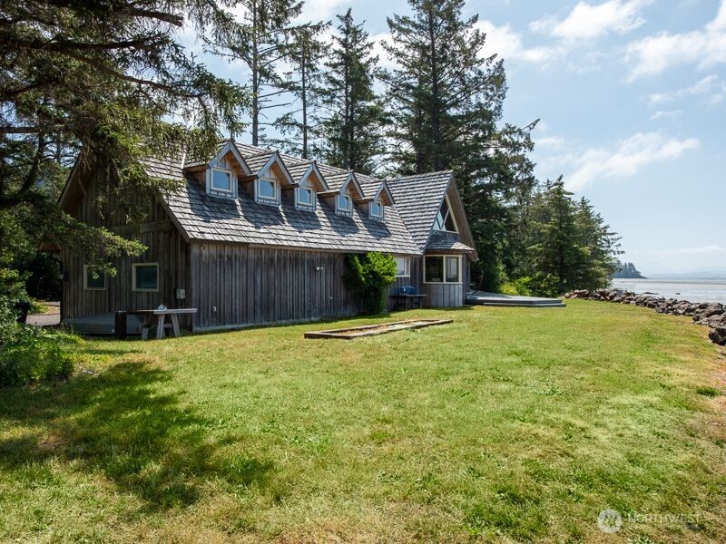 633 Highway 101 Chinook, WA 98614 - Photo 3 of 39 a view of a house with a yard