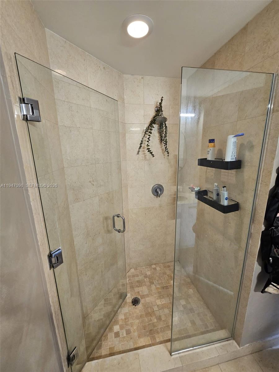 1060 Brickell Avenue, Unit 1917 Miami, FL 33131 - Photo 14 of 24 a bathroom with a shower