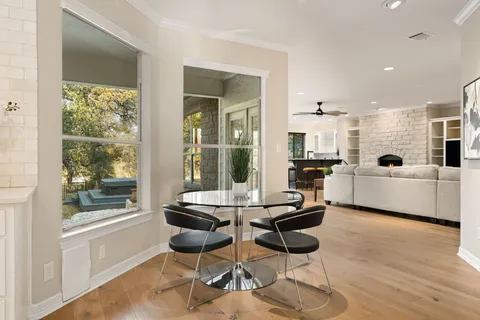 a kitchen with granite countertop a sink and a stove top oven