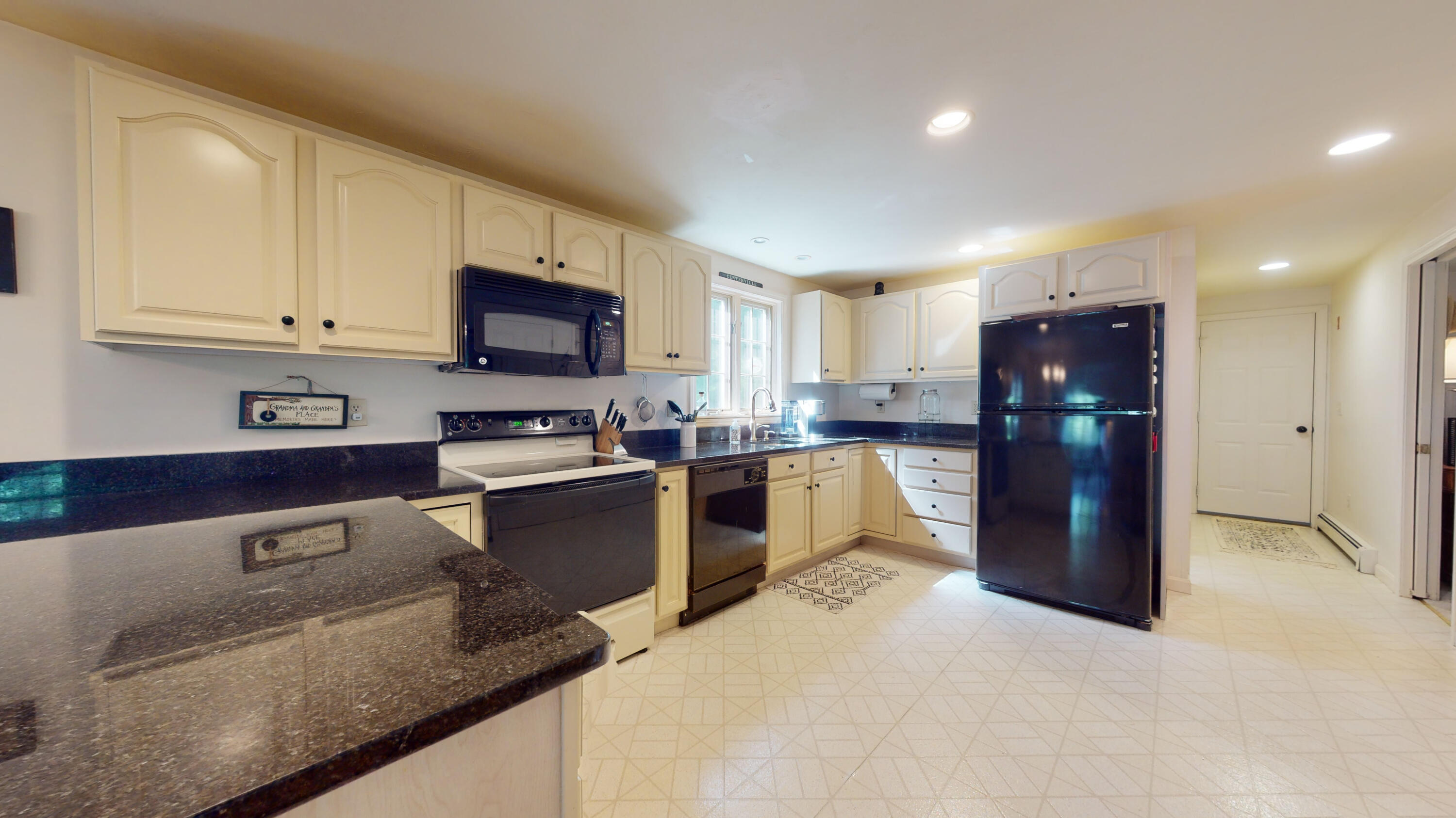 9 Rainbow Drive Centerville, MA 02632 - Photo 12 of 49 a kitchen with granite countertop a refrigerator and a stove top oven