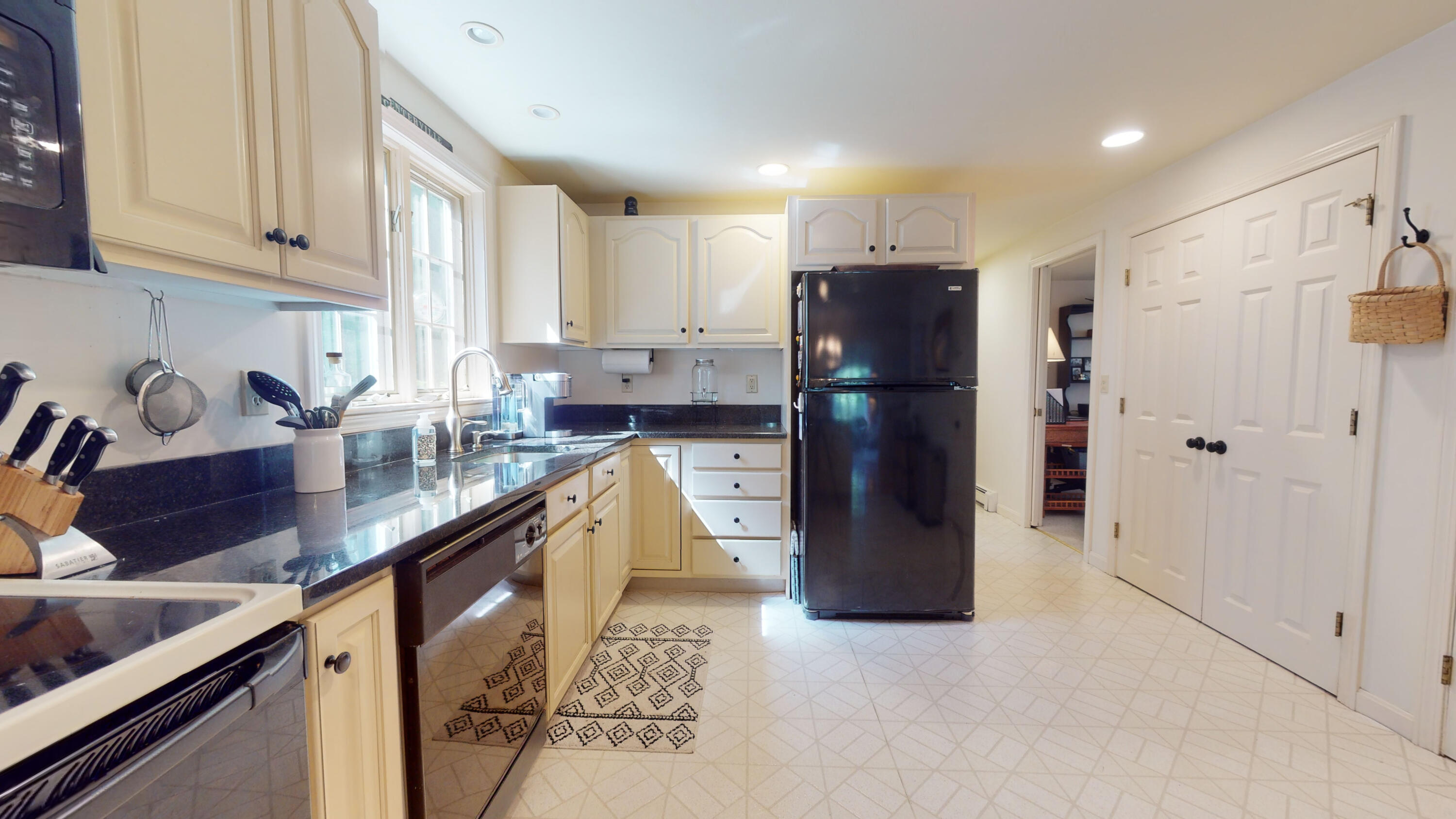 9 Rainbow Drive Centerville, MA 02632 - Photo 13 of 49 a kitchen with refrigerator and cabinets