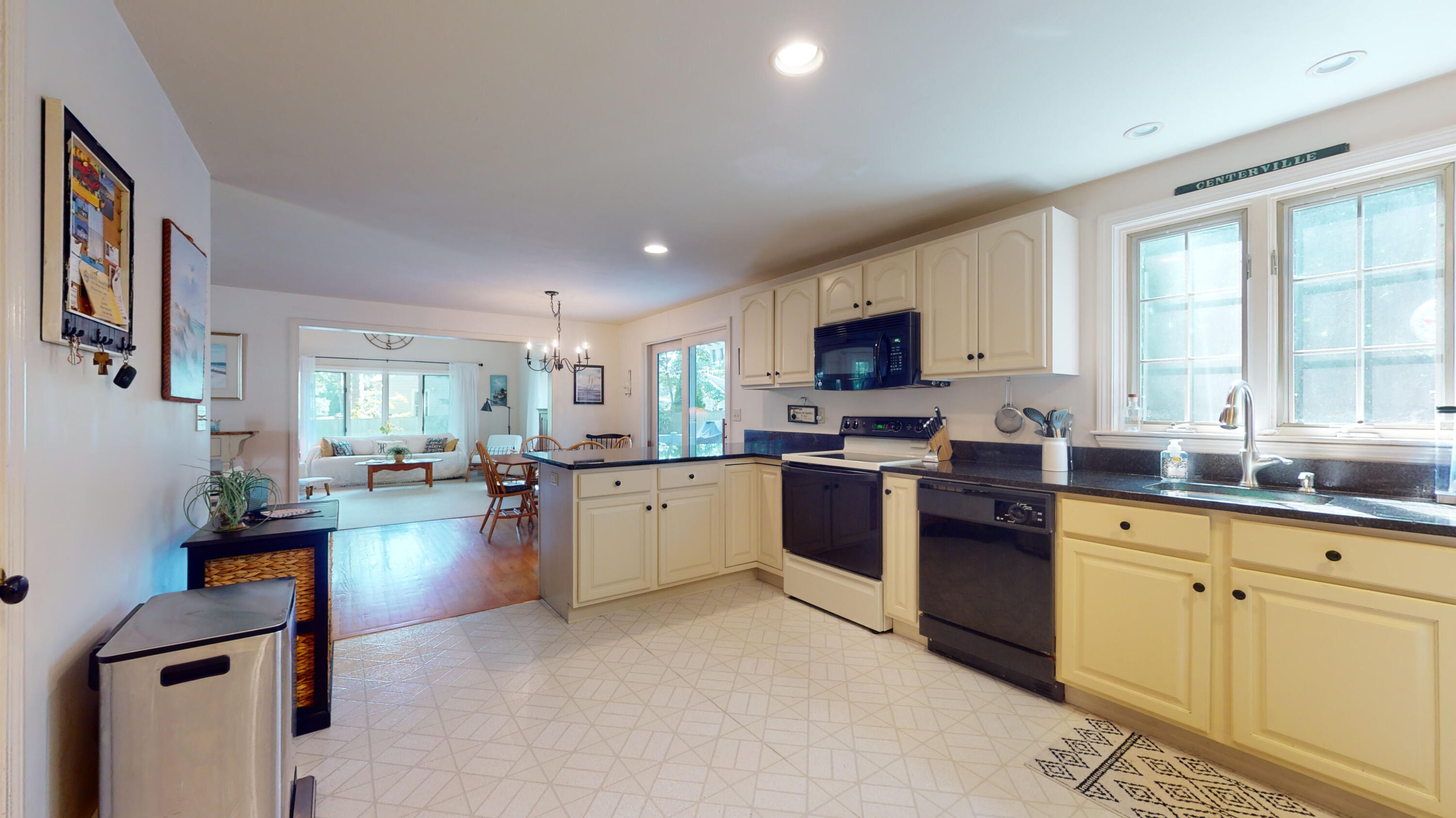 9 Rainbow Drive Centerville, MA 02632 - Photo 15 of 49 a kitchen with sink a stove and cabinets