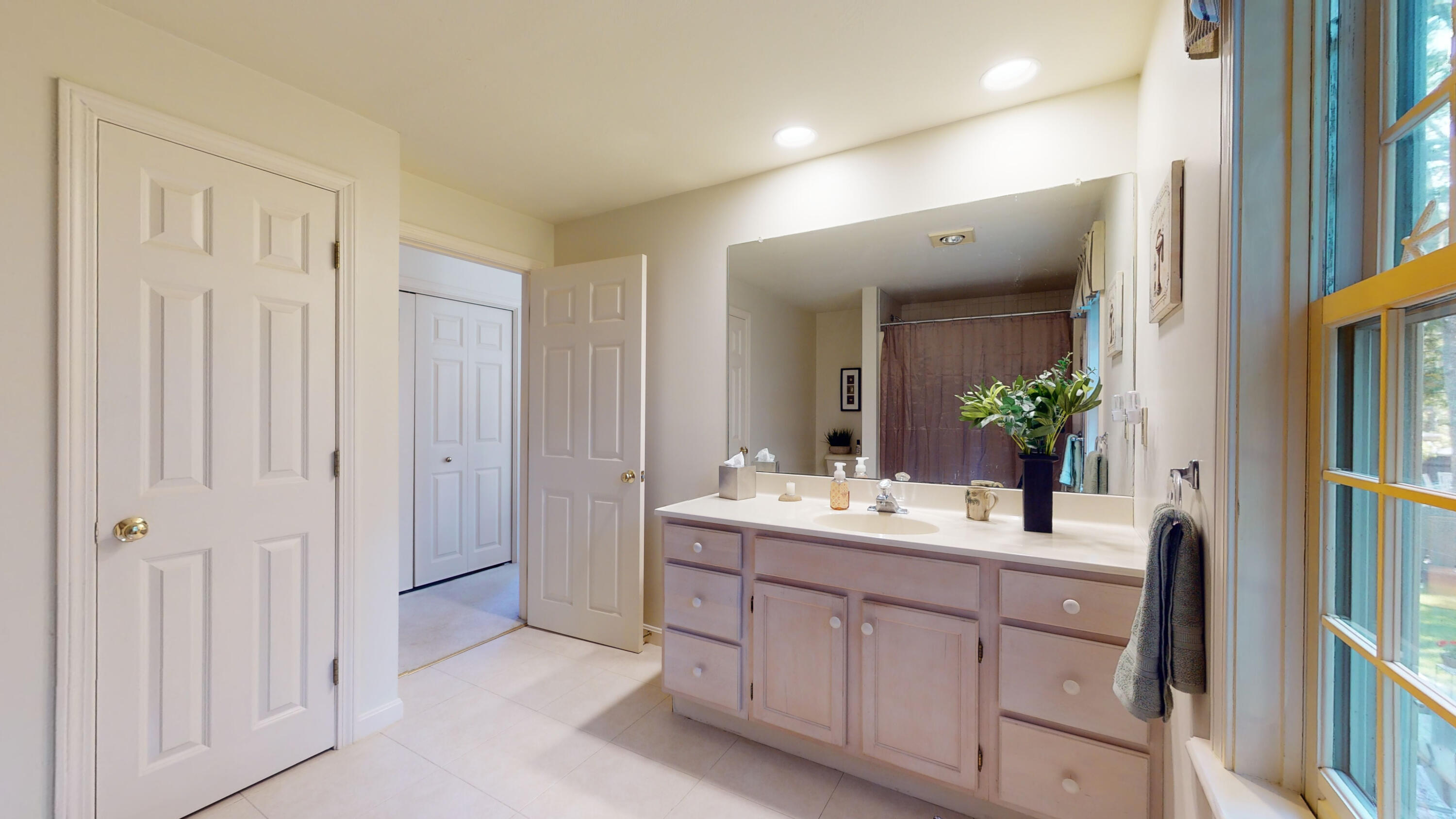 9 Rainbow Drive Centerville, MA 02632 - Photo 25 of 49 a spacious bathroom with a double vanity sink and a mirror