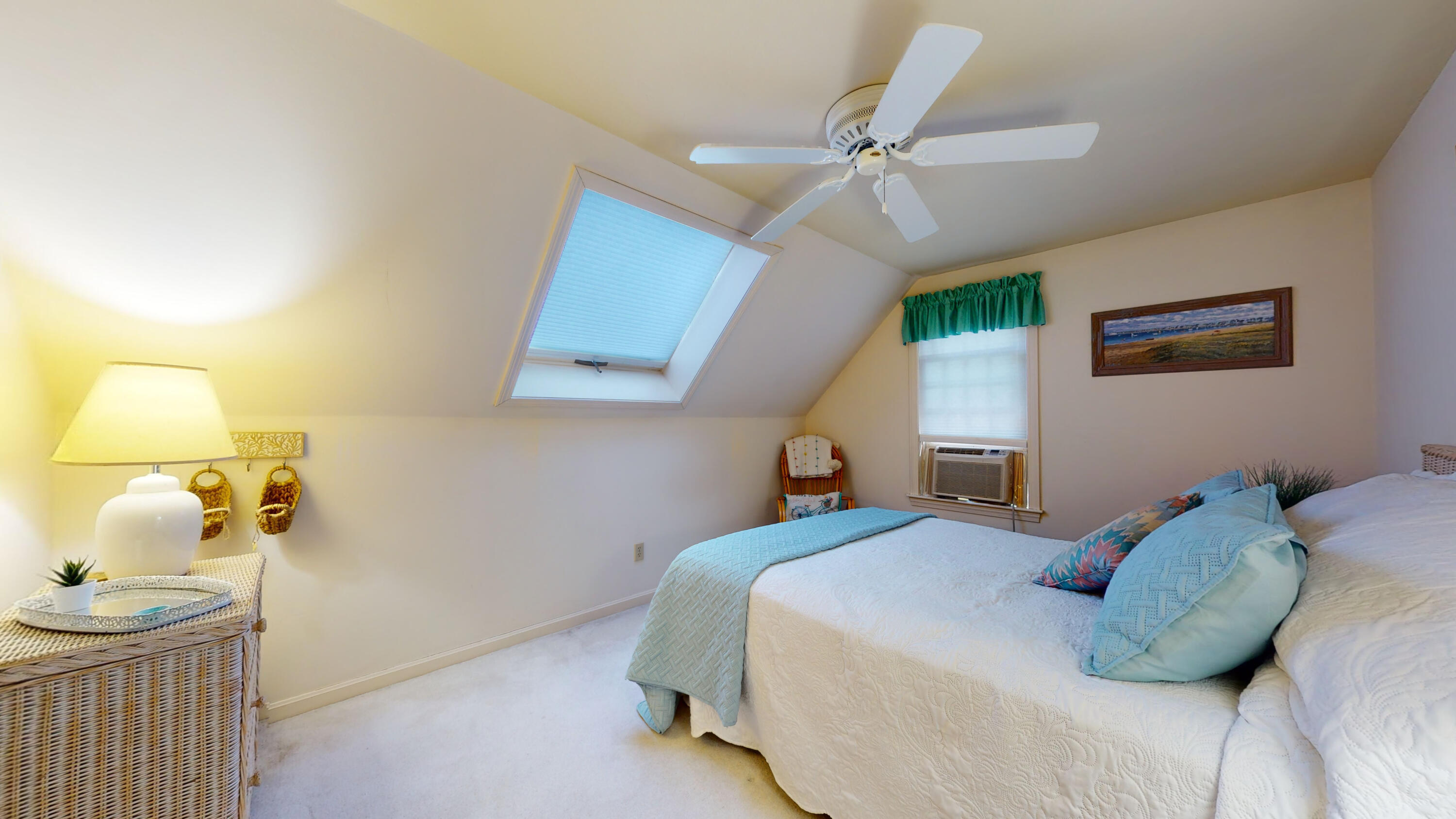 9 Rainbow Drive Centerville, MA 02632 - Photo 26 of 49 a bedroom with a bed and a chandelier