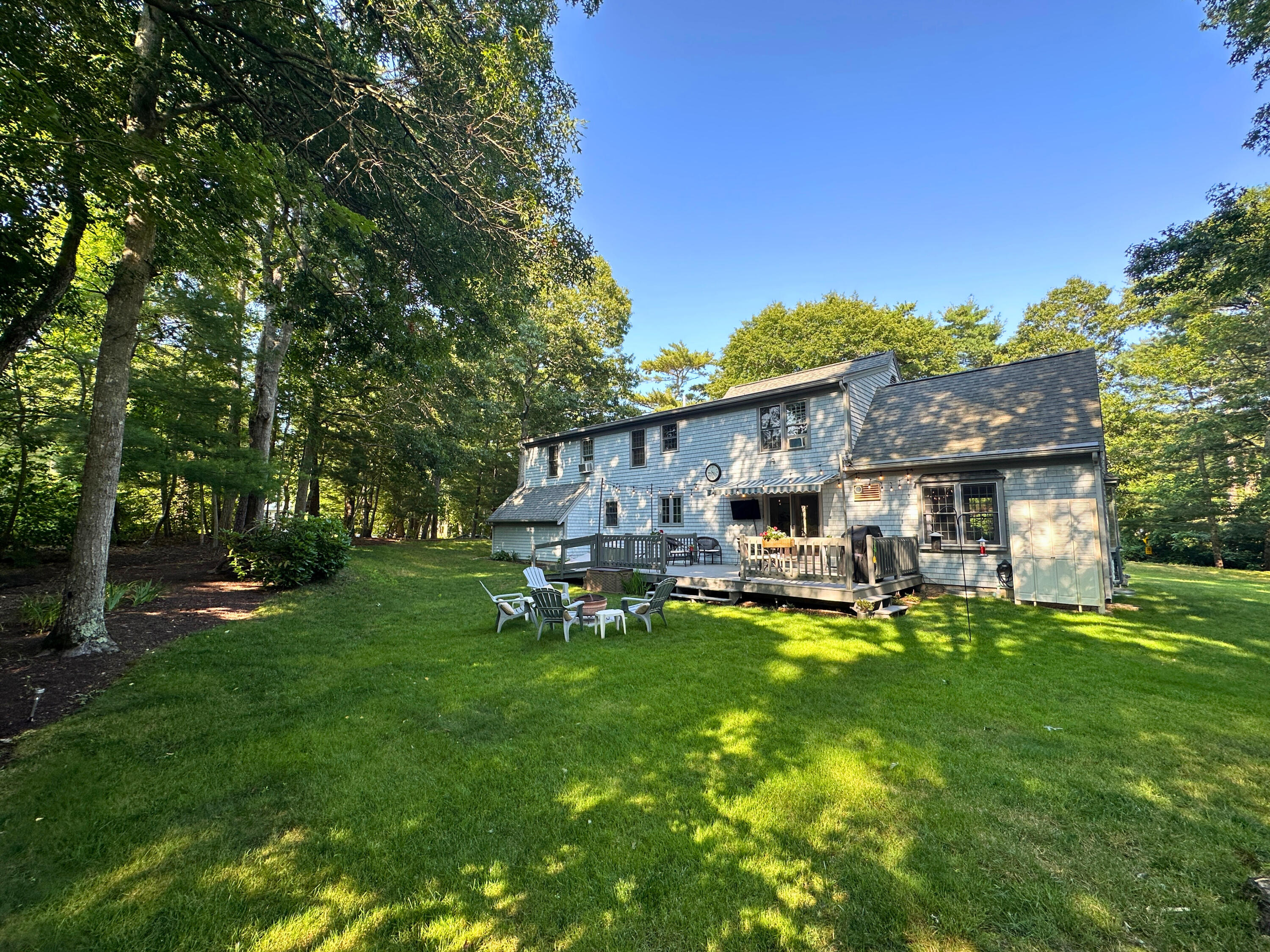 9 Rainbow Drive Centerville, MA 02632 - Photo 36 of 49 a view of a house with a yard porch and sitting area