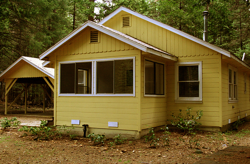 9455 Thatcher Mill Road Shingletown, CA 96088 - Photo 1 of 22 a front view of a house with garden