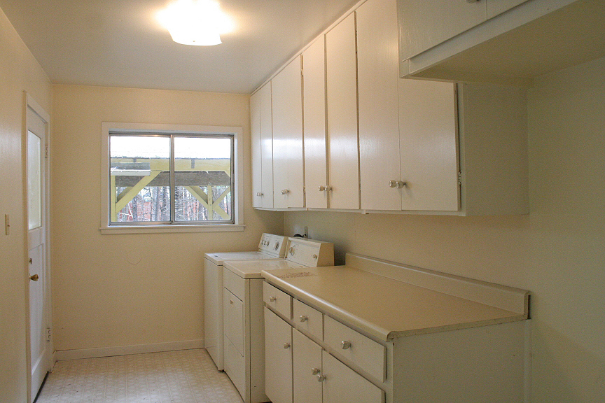 9455 Thatcher Mill Road Shingletown, CA 96088 - Photo 11 of 22 a room with a sink cabinets appliances and a window