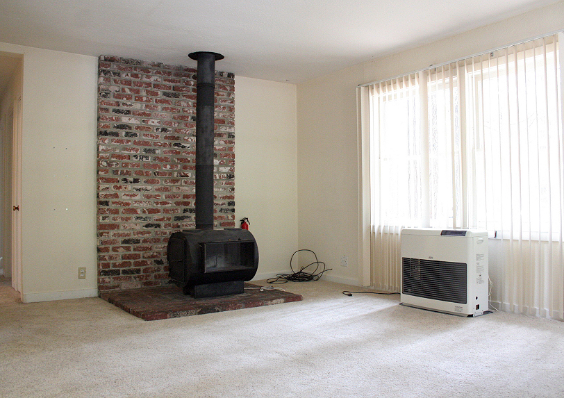 9455 Thatcher Mill Road Shingletown, CA 96088 - Photo 4 of 22 a view of empty room with fireplace and window
