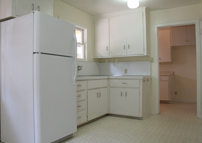 9455 Thatcher Mill Road Shingletown, CA 96088 - Photo 6 of 22 a kitchen with white cabinets and refrigerator