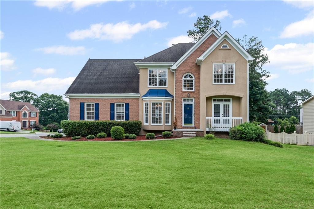 a front view of a house with a yard