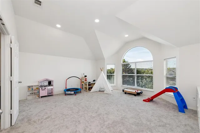 a view of play room with gym equipment