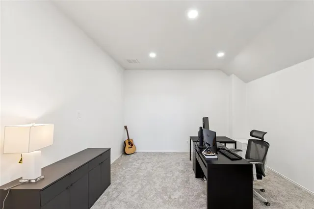 a view of a workspace with furniture