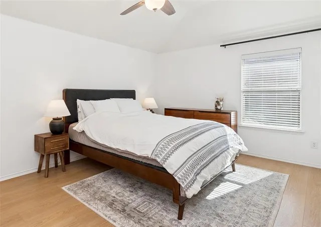 a bedroom with a bed and a table in it