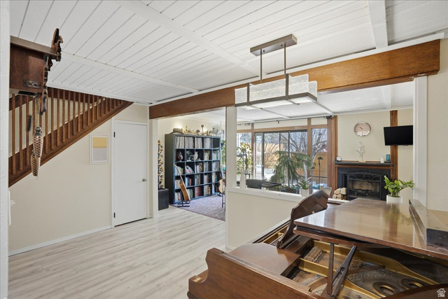 Dining area featuring a fireplace and wood finished floors