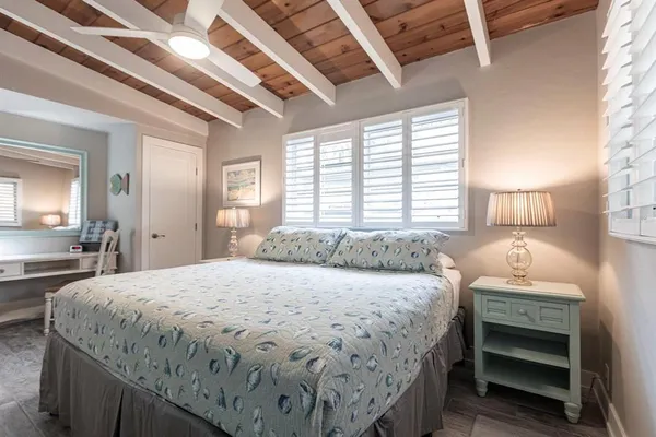 a bedroom with a bed and a dresser