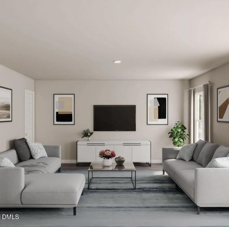 135 Payton Place Roxboro, NC 27573 - Photo 4 of 8 a living room with furniture and a flat screen tv