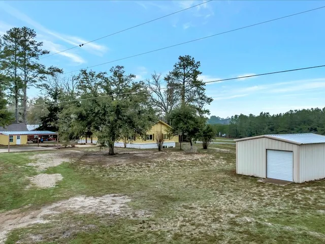 a backyard of a house with lots of green space