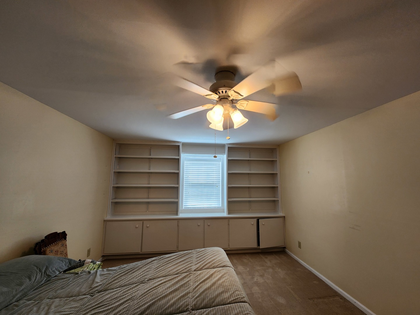 1050 5 South Nelson Avenue, Unit 4 Kankakee, IL 60901 - Photo 12 of 29 a bedroom with a bed and a chandelier