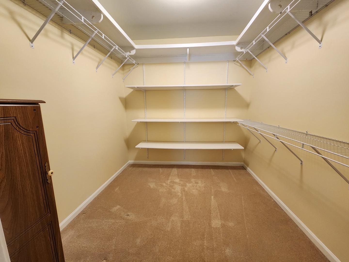1050 5 South Nelson Avenue, Unit 4 Kankakee, IL 60901 - Photo 14 of 29 a view of walk in closet with empty racks