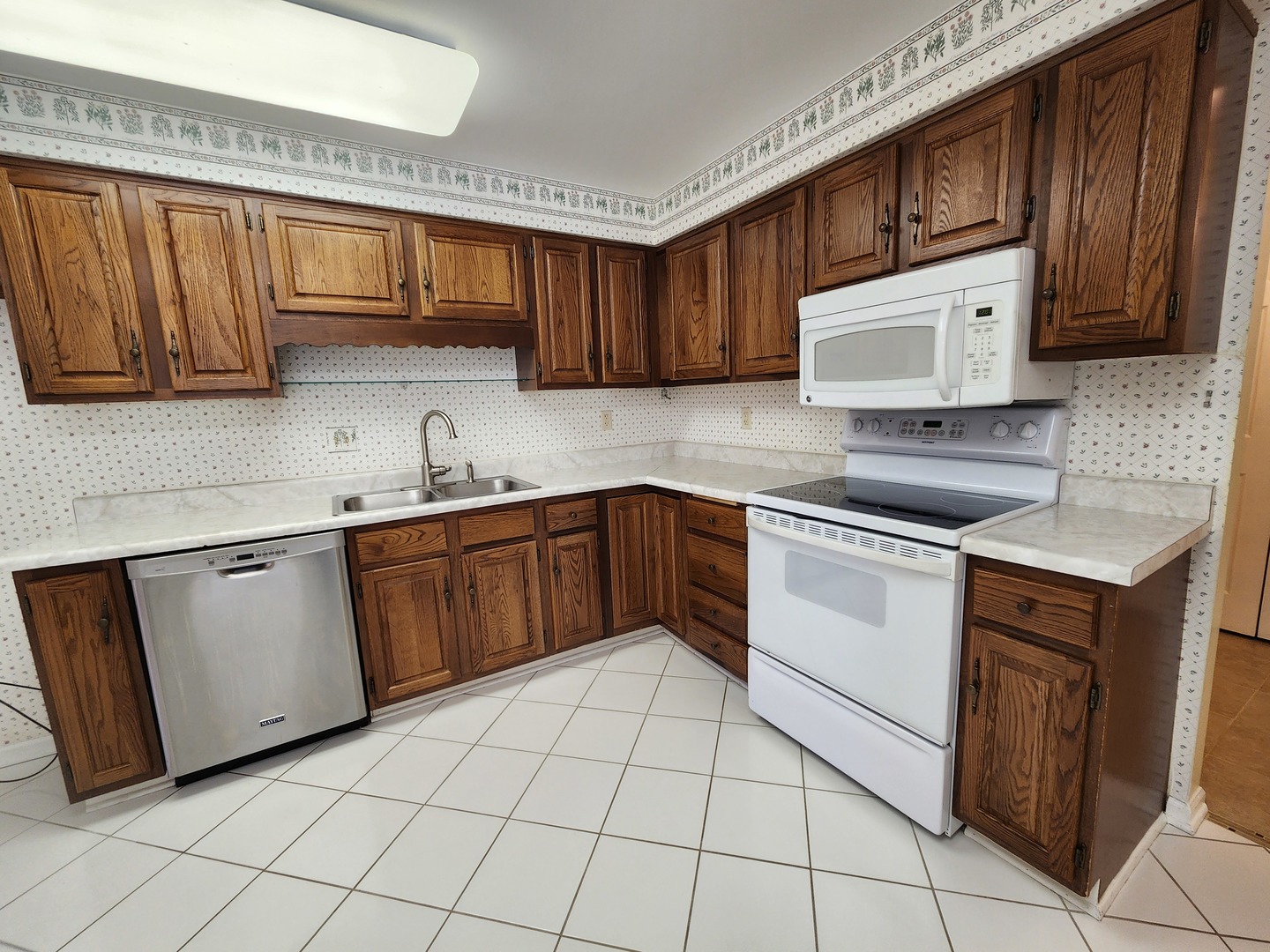 1050 5 South Nelson Avenue, Unit 4 Kankakee, IL 60901 - Photo 8 of 29 a kitchen with stainless steel appliances granite countertop a sink and cabinets