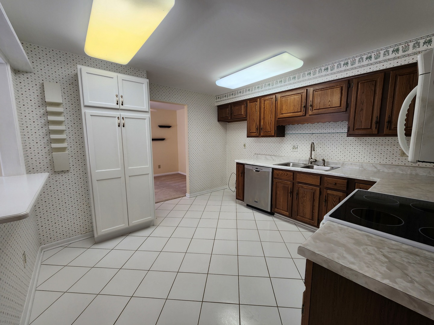 1050 5 South Nelson Avenue, Unit 4 Kankakee, IL 60901 - Photo 9 of 29 a kitchen with a sink a refrigerator and cabinets