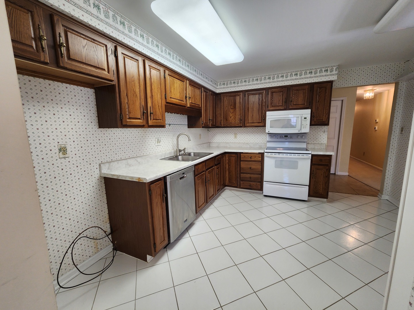 1050 5 South Nelson Avenue, Unit 4 Kankakee, IL 60901 - Photo 10 of 29 a kitchen with stainless steel appliances granite countertop a stove a sink and a microwave