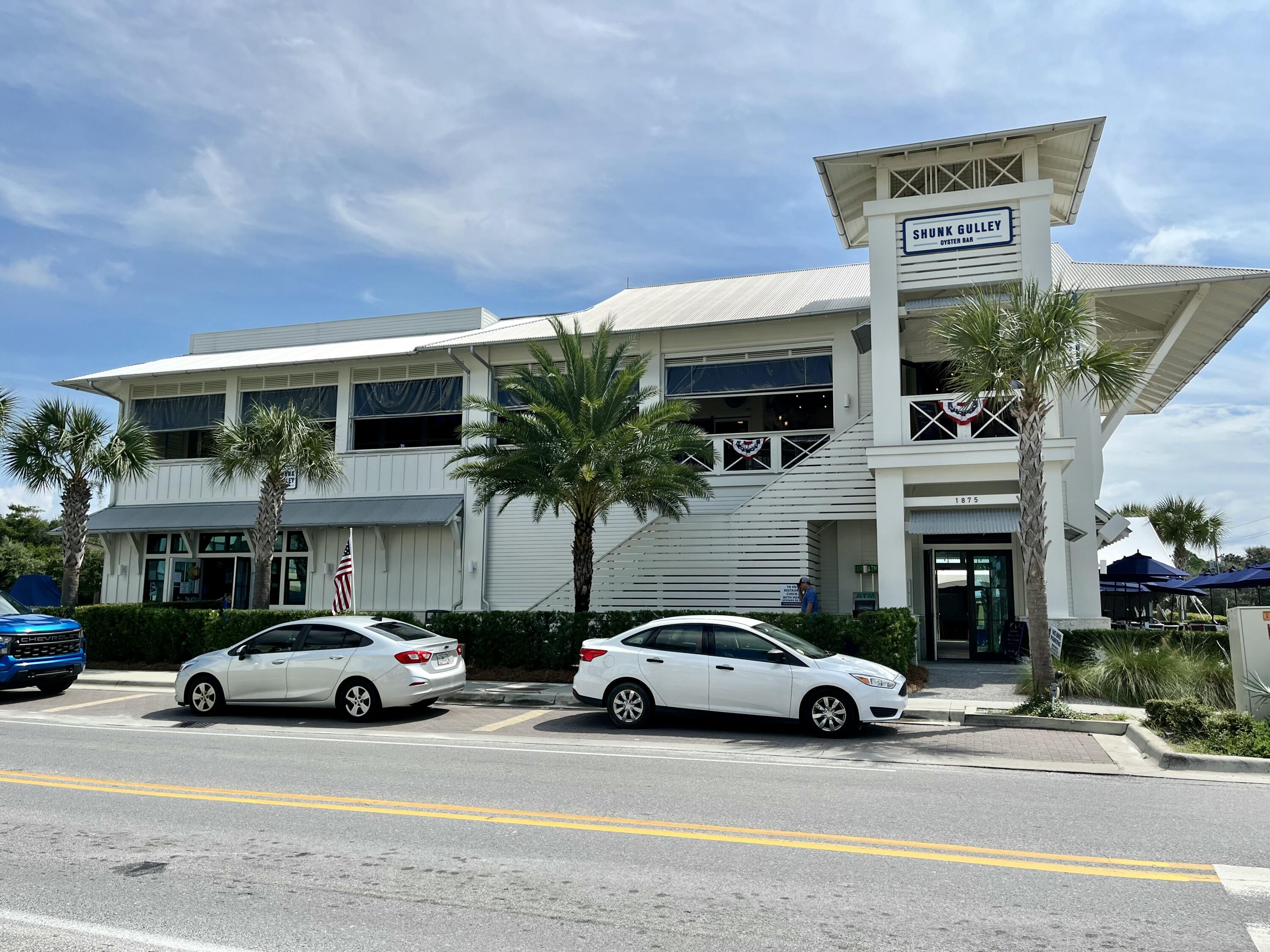 35 Brizo Lane, Unit LOT 1 Santa Rosa Beach, FL 32459 - Photo 19 of 20 a view of a cars parked in front of a building
