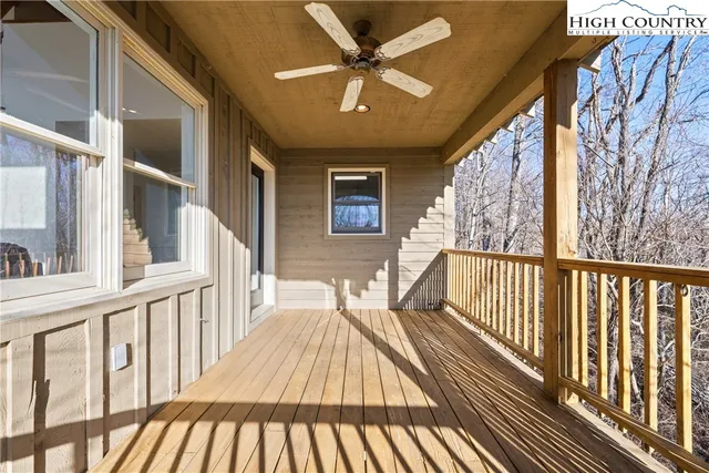 a view of a balcony with wooden floor