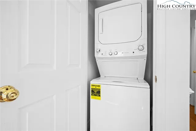 a bedroom with furniture and a flat screen tv