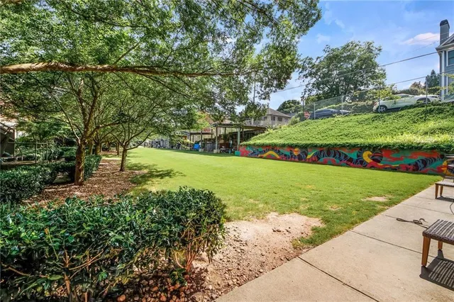 a view of a park with large trees