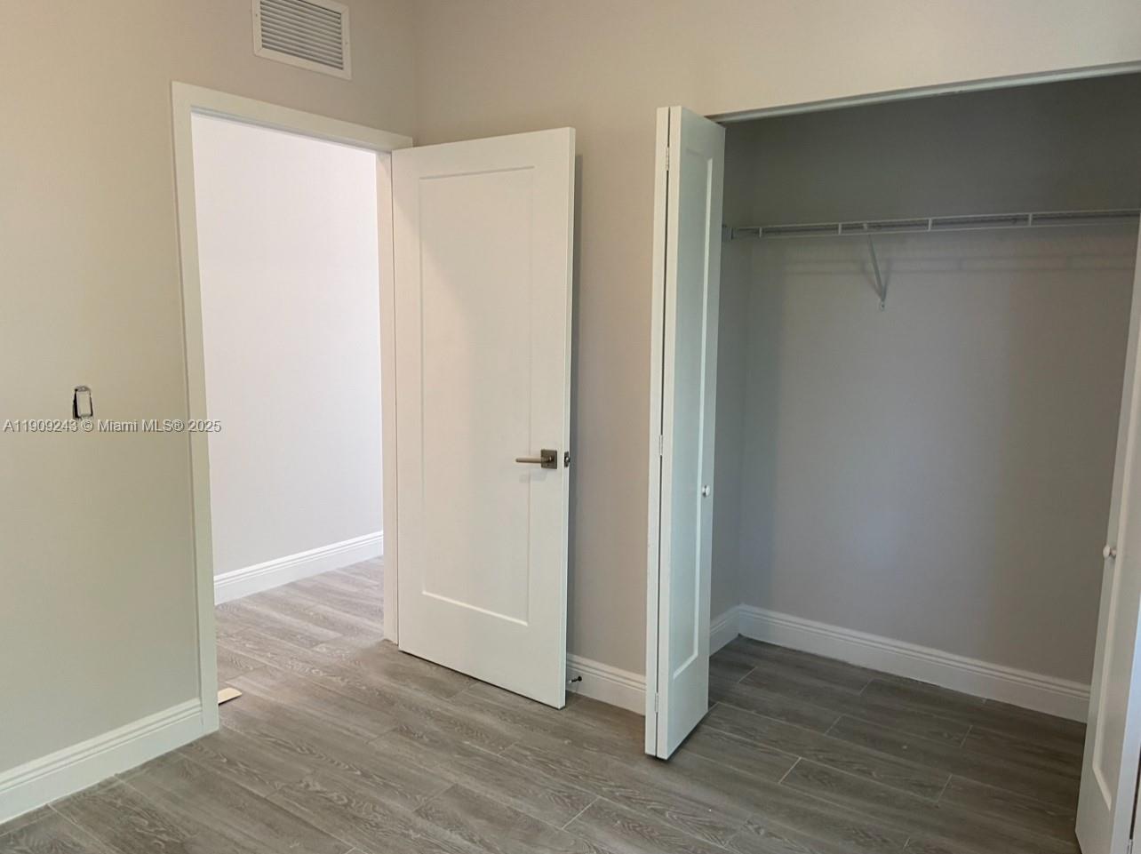 175 East 16th Street, Unit 175 Hialeah, FL 33010 - Photo 13 of 19 a view of an empty room with wooden floor