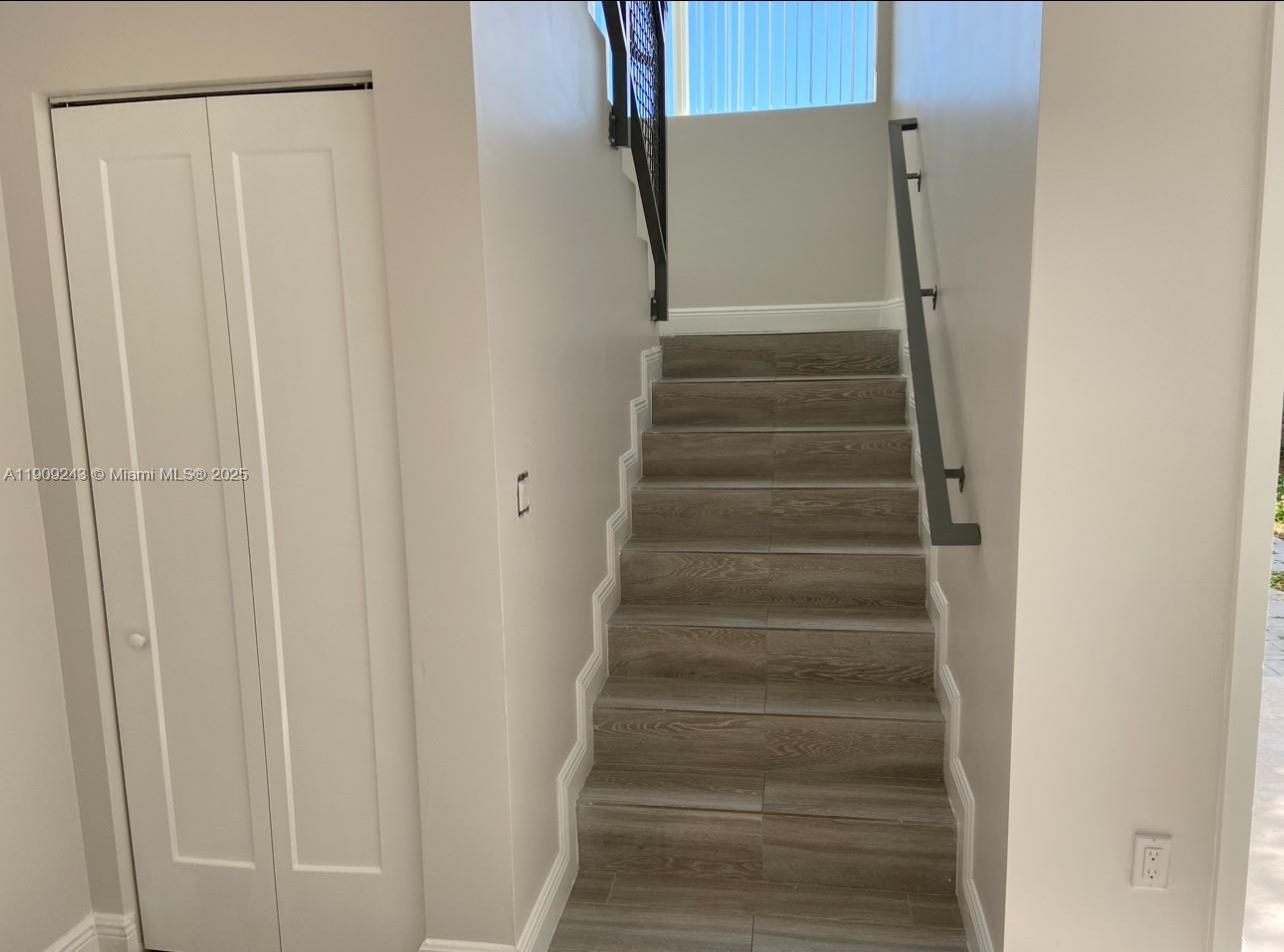 175 East 16th Street, Unit 175 Hialeah, FL 33010 - Photo 19 of 19 a view of staircase with white walls and white door