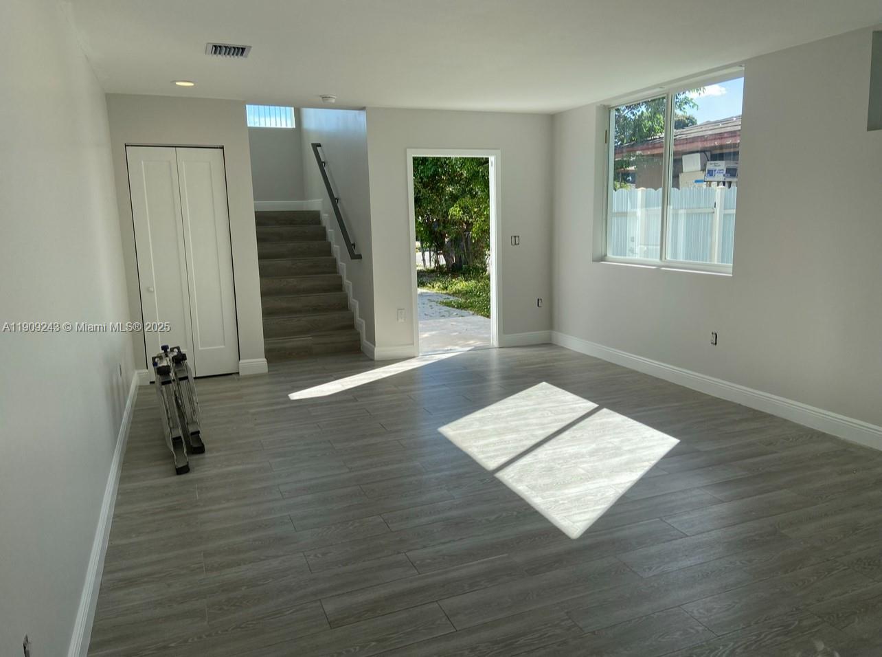 175 East 16th Street, Unit 175 Hialeah, FL 33010 - Photo 5 of 19 a view of a room with wooden floor and stairs