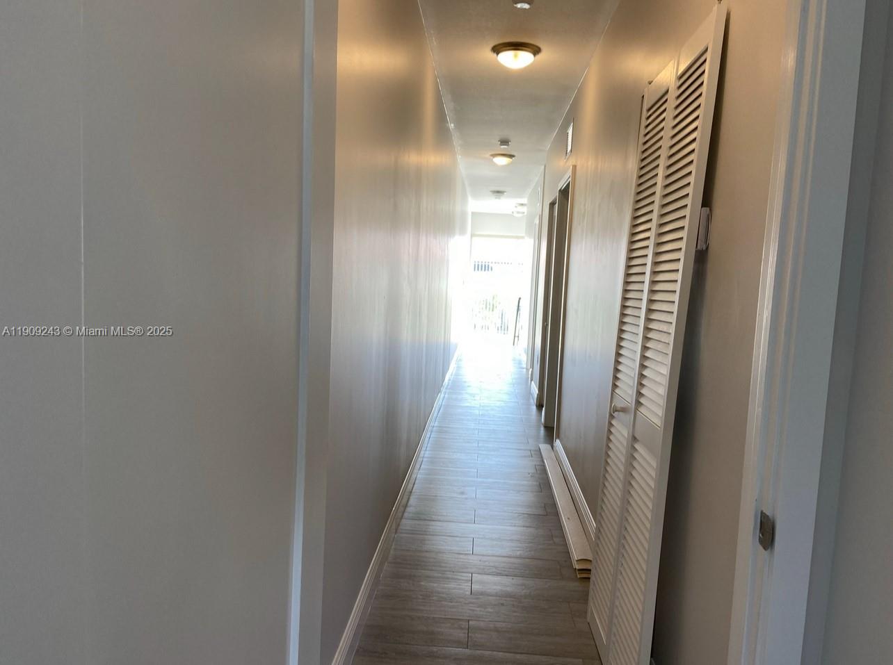 175 East 16th Street, Unit 175 Hialeah, FL 33010 - Photo 6 of 19 a view of a hallway with wooden floor and staircase