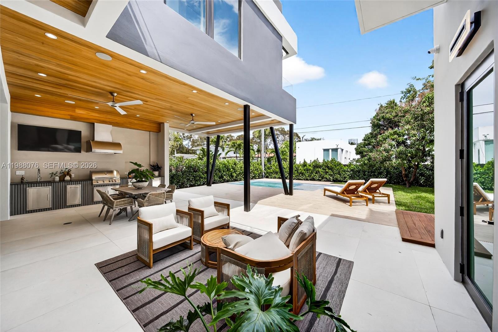 609 Southwest 24th Road Miami, FL 33129 - Photo 15 of 50 a outdoor space with patio the couches and a dining table with chairs and potted plants
